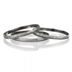 Silver oval bangles by Kendra Renee
